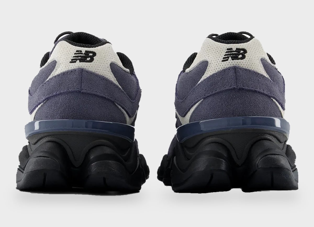 Heel view of navy suede pair with New Balance logo on cream heel tab and black sole, Balance 9060 Trail