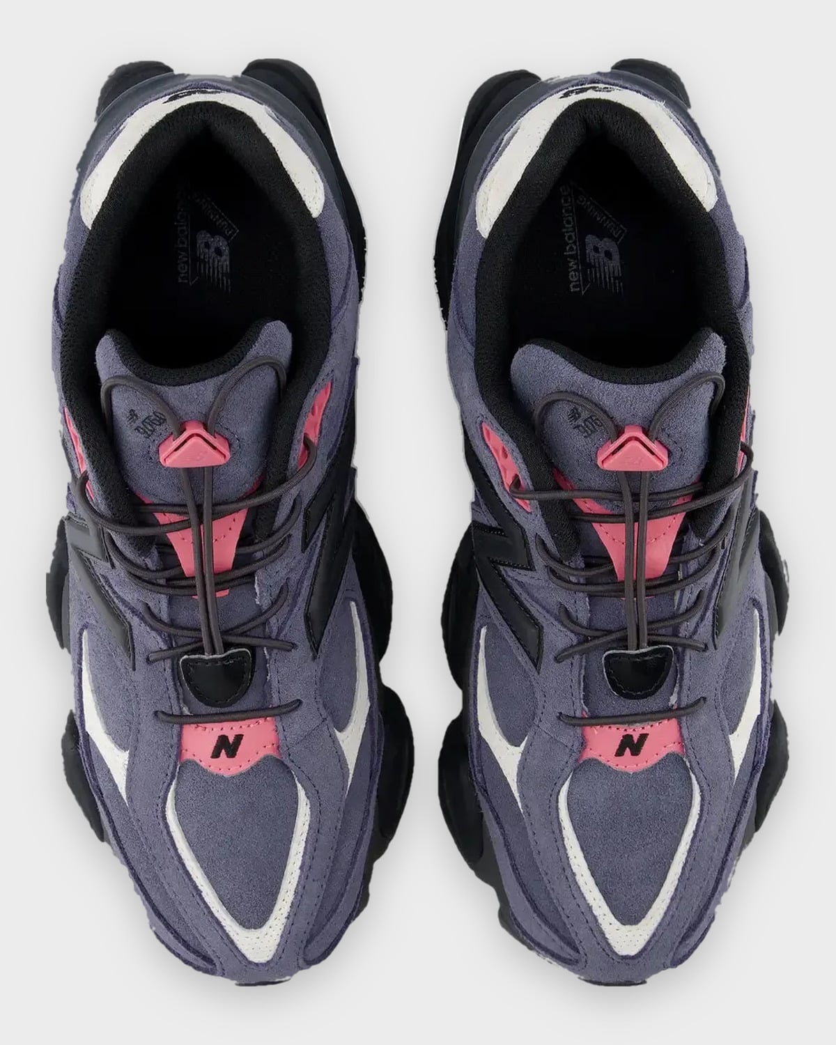 Top-down view of navy suede pair with pink accents, bungee laces and black N logos, Balance 9060 Trail