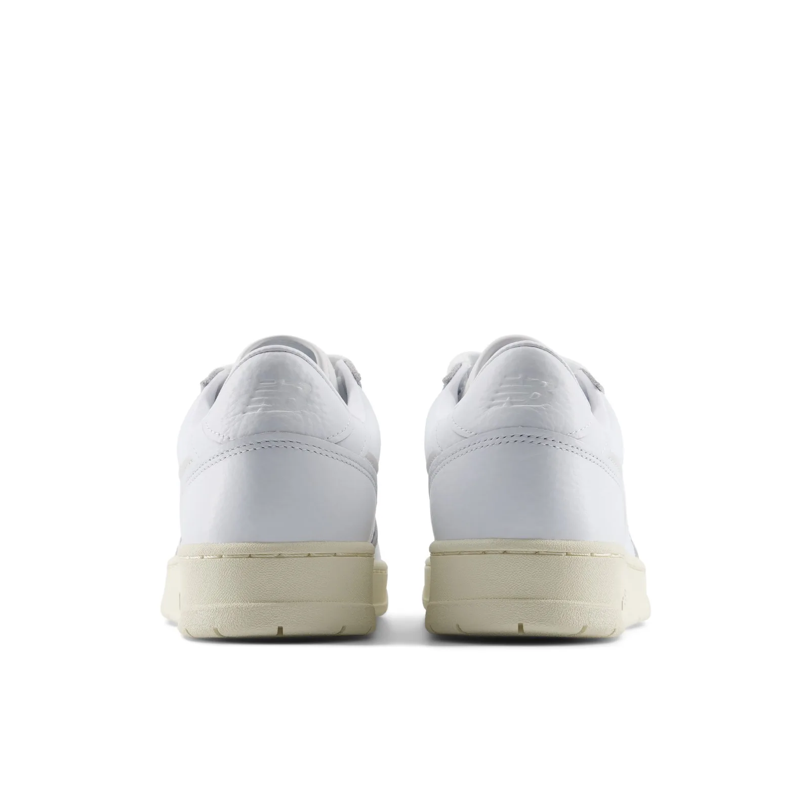 Heel view of pair, white leather with embossed NB logo and cream midsole, White/Angora