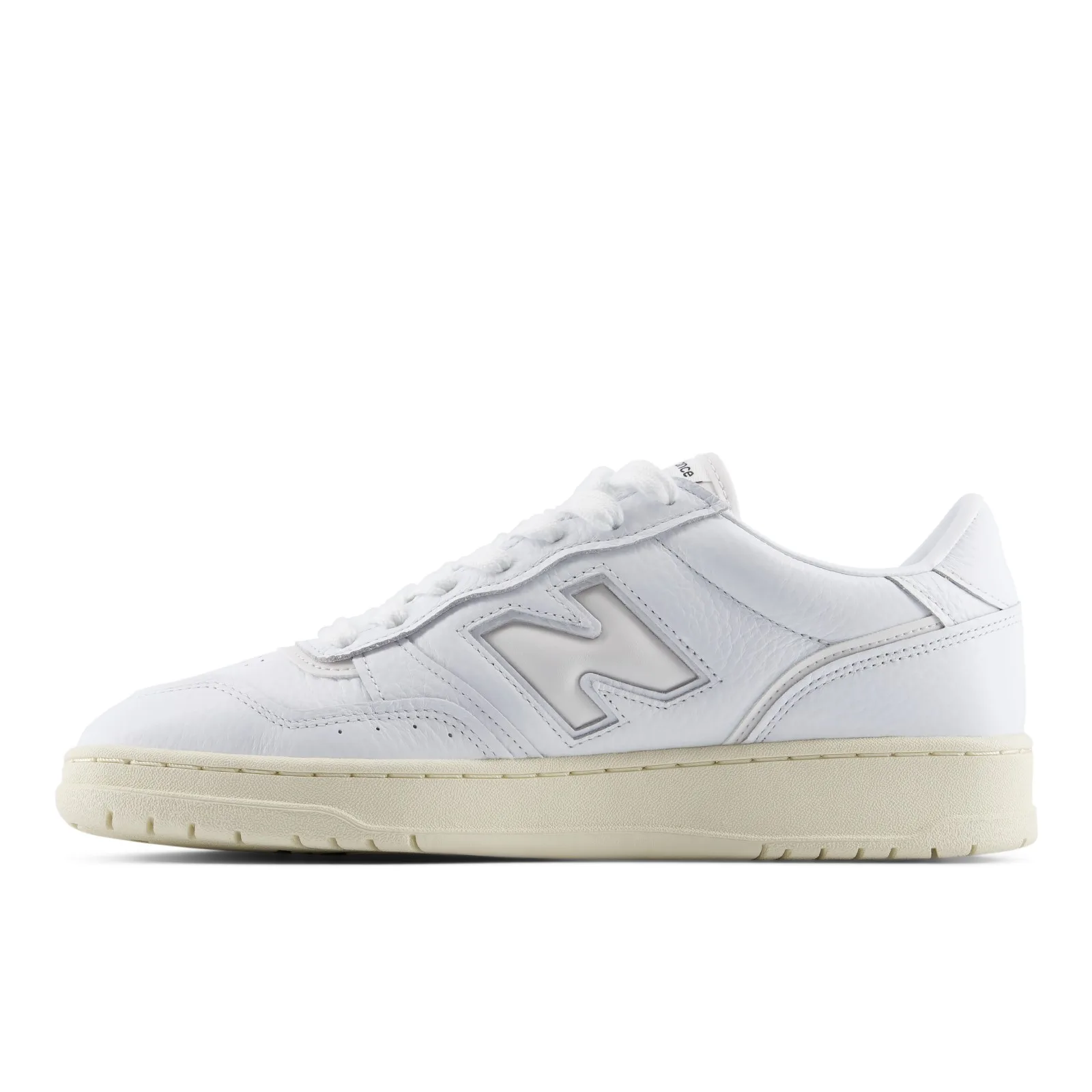 Medial view, white leather with grey N logo and cream midsole, toe at left, White/Angora