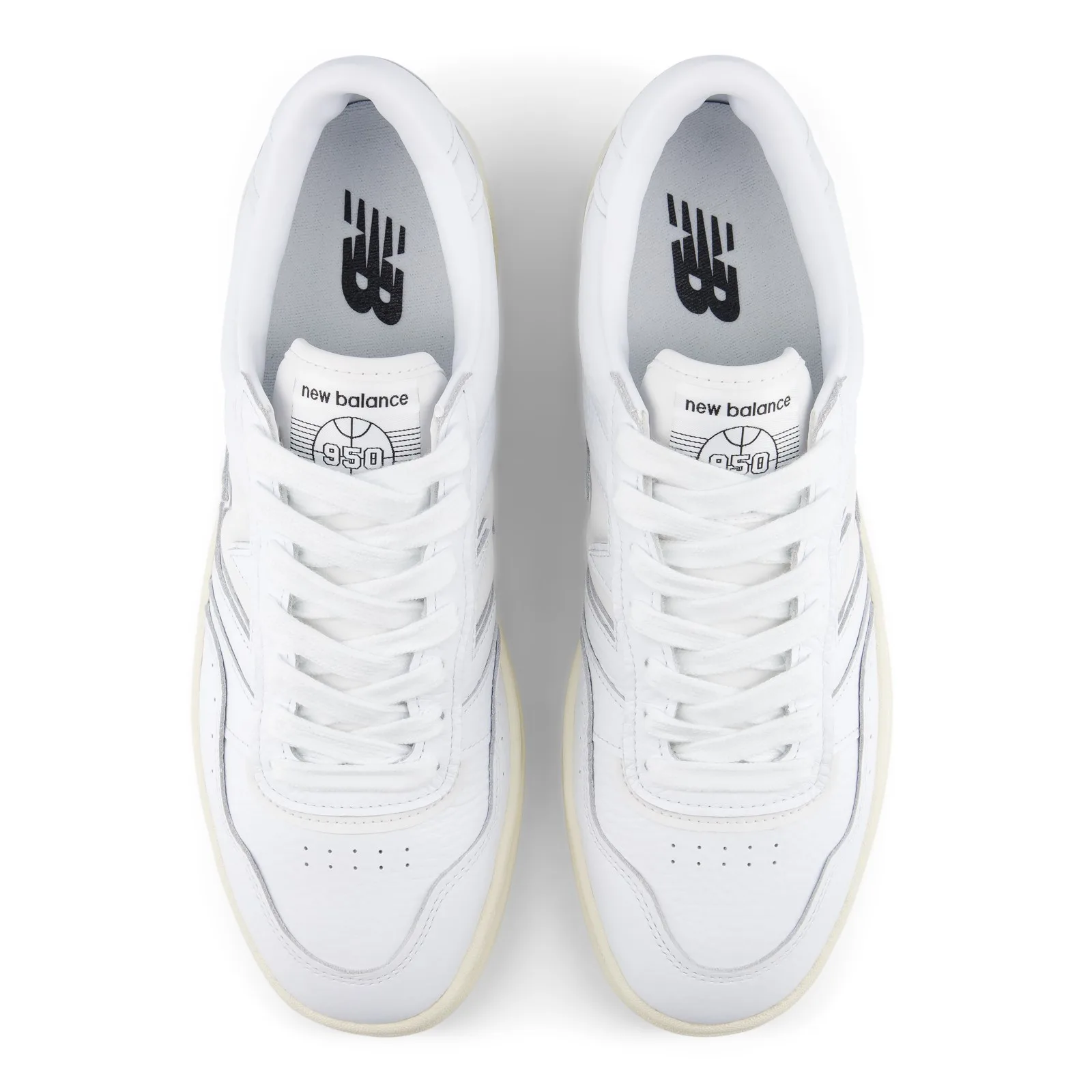 Top-down view of pair, white laces, new balance 950 tongue labels, black NB logo insoles, White/Angora