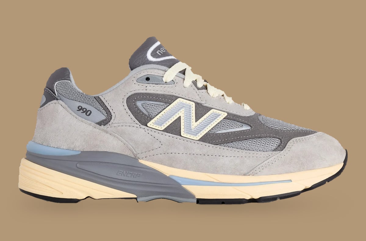 Lateral view, grey suede and mesh with N logo and cream midsole on tan, Kool Grey