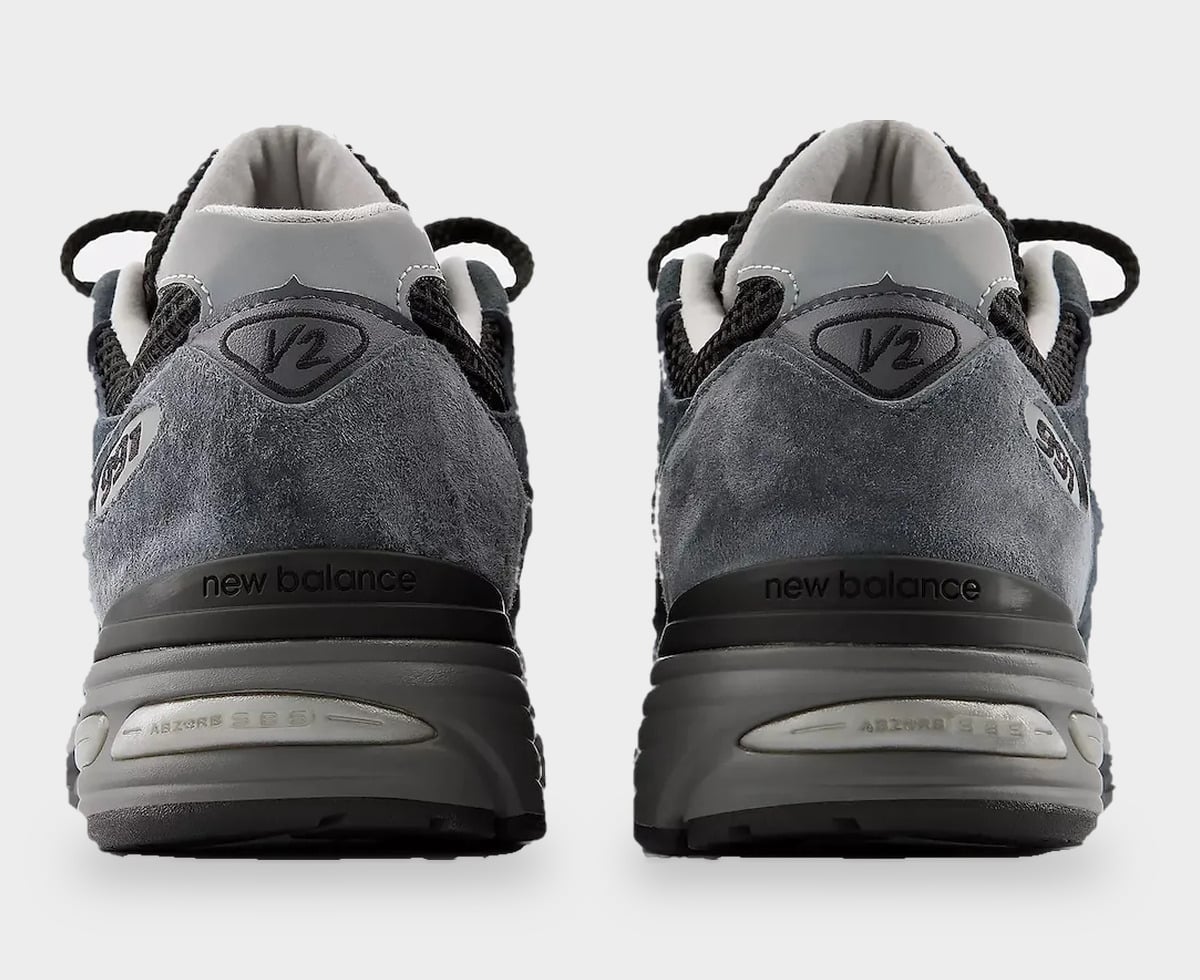 Heel view of pair, grey suede counters, V2 badge and new balance text on black heel band, Turbulence/India Ink