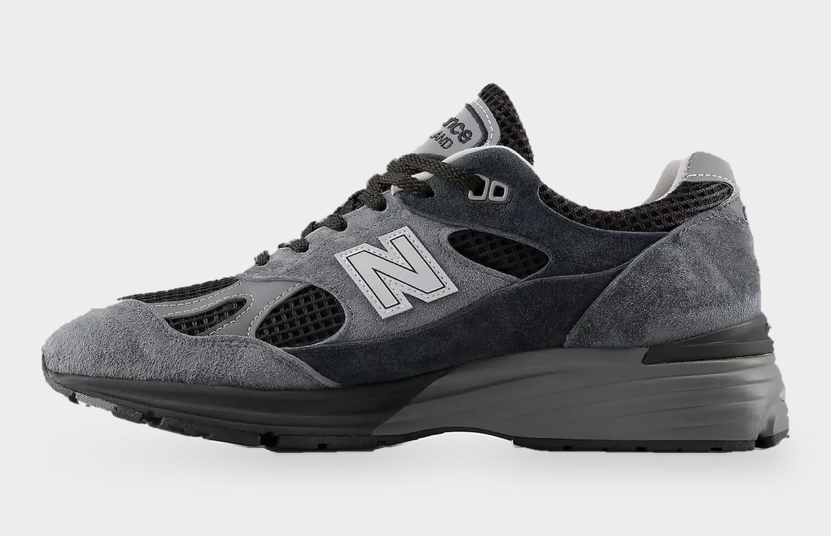 Medial view with grey N logo, black mesh cutouts, grey suede toe and thick grey midsole, Turbulence/India Ink