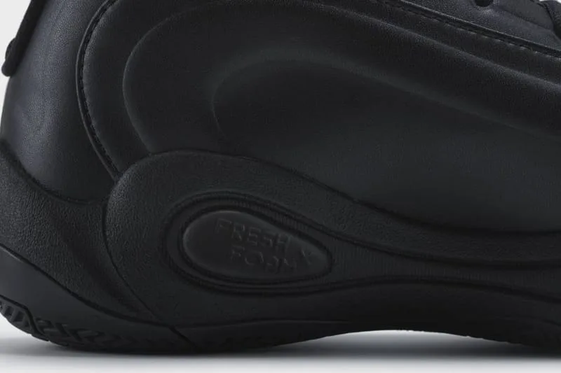 Detail of a black heel with sculpted panels and an oval pod debossed with Fresh Foam text, Watanabe MAN P400