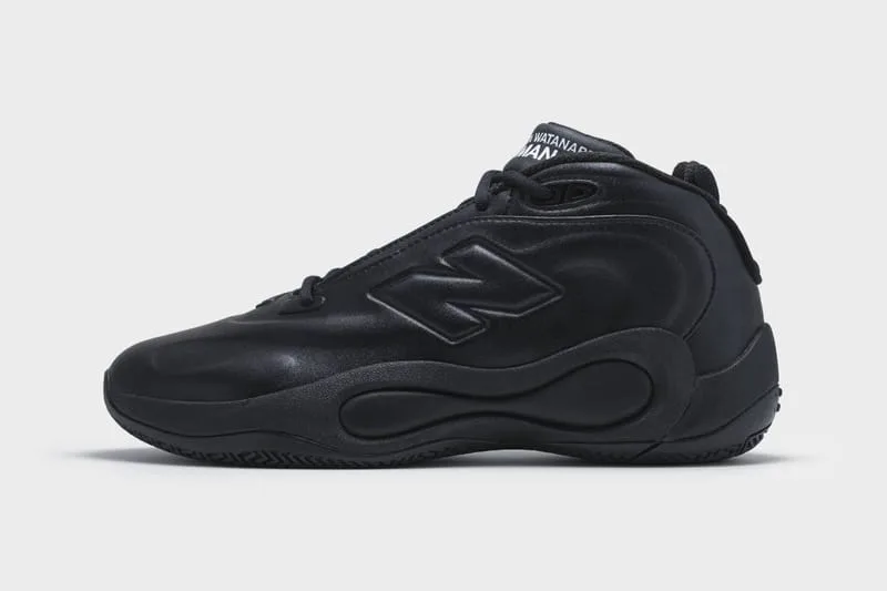 Lateral view of an all-black leather mid-top with a raised N logo and a wavy sculpted midsole, Watanabe MAN P400