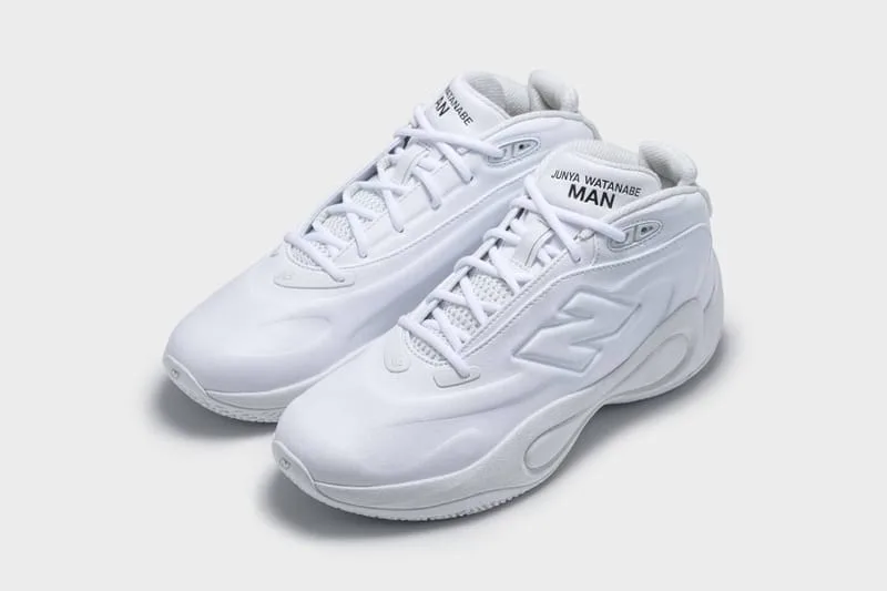 Three-quarter view of an all-white pair with white laces and black Junya Watanabe MAN tongue text, Watanabe MAN P400