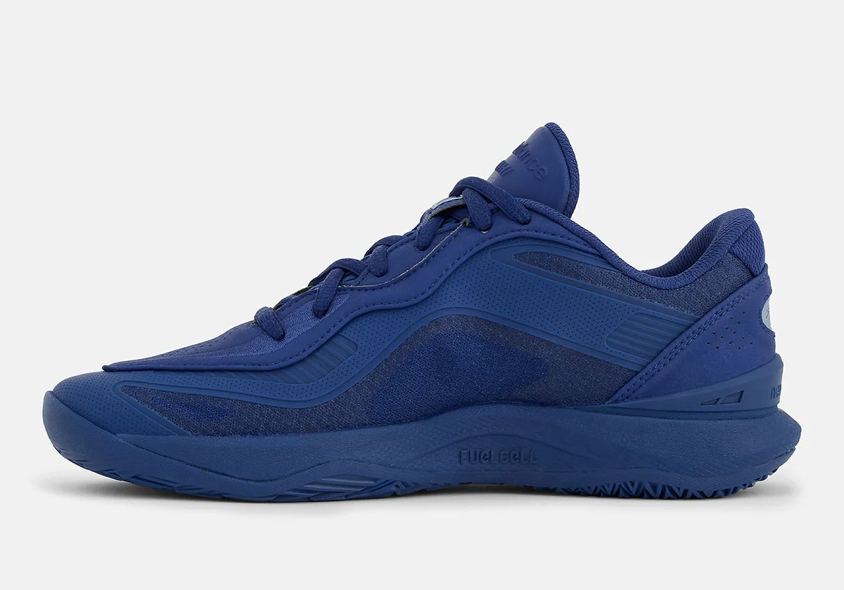 Medial view of all-blue shoe with FUELCELL text on the midsole and mesh side panels, Balance Kawhi 5
