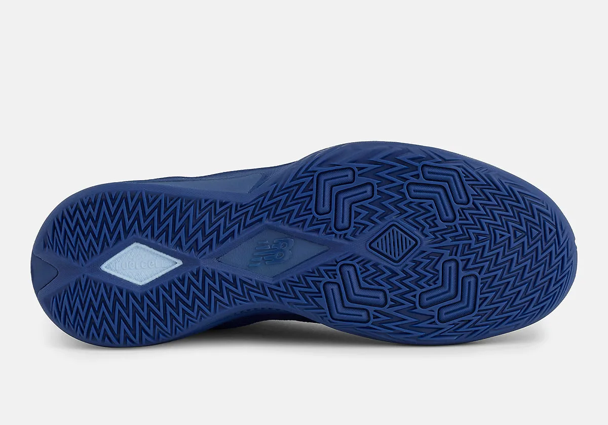 Outsole of blue shoe with zigzag traction pattern, chevron pods and pale blue FuelCell patch, Balance Kawhi 5