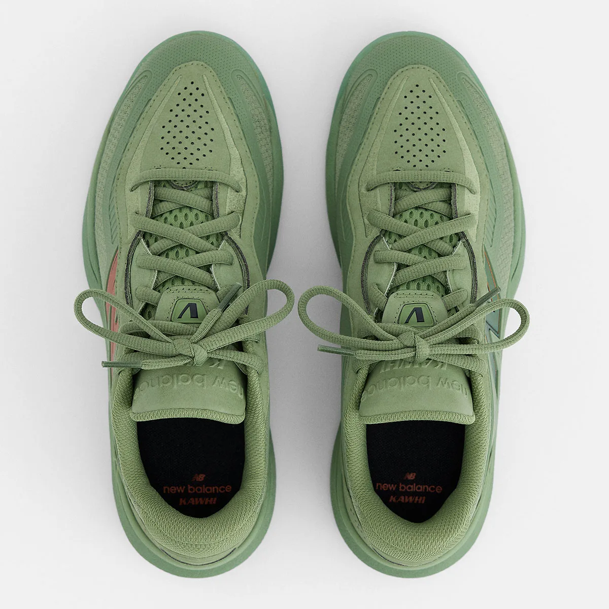 Top-down view of green pair with bow-tied laces, perforated toe and black insoles marked Kawhi, Balance Kawhi 5