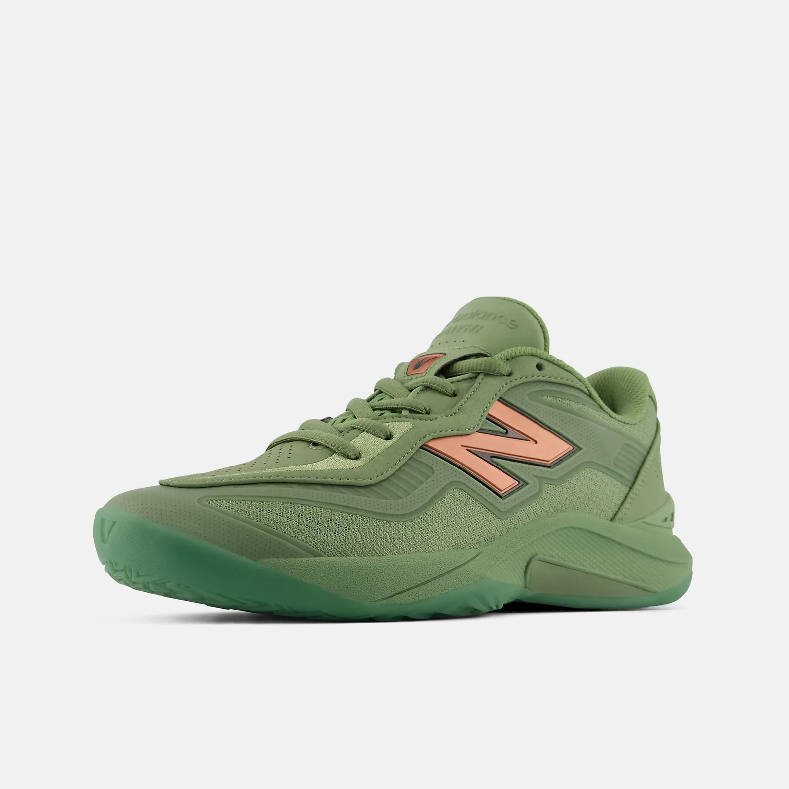 Three-quarter toe view of green shoe with copper N logo, perforated toe box and icy green sole, Oregano