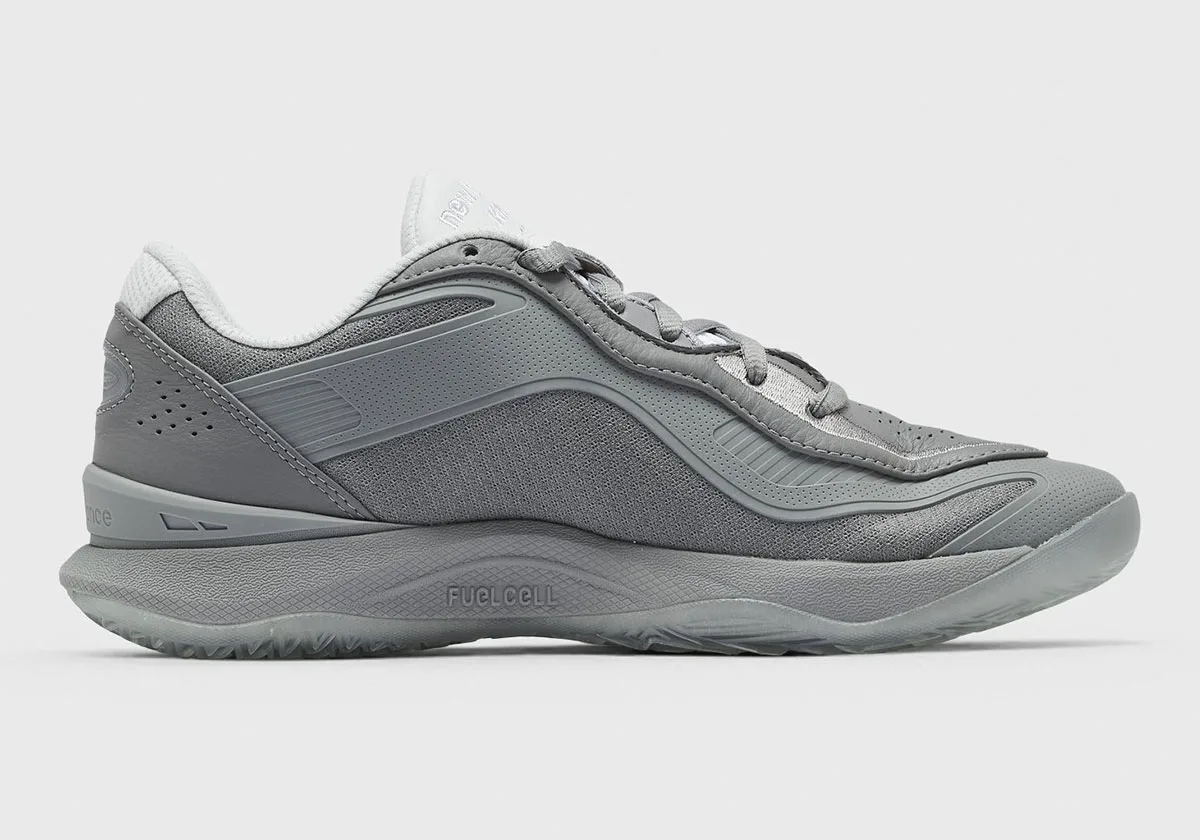 Medial view of a grey sneaker with FuelCell text on the midsole and white collar, Slate Grey