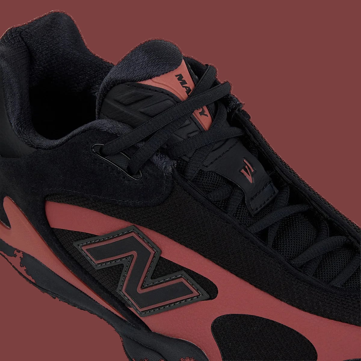 Detail of lateral side and laces, black N logo, red-brown overlay, v1 tongue tag, Red Rock