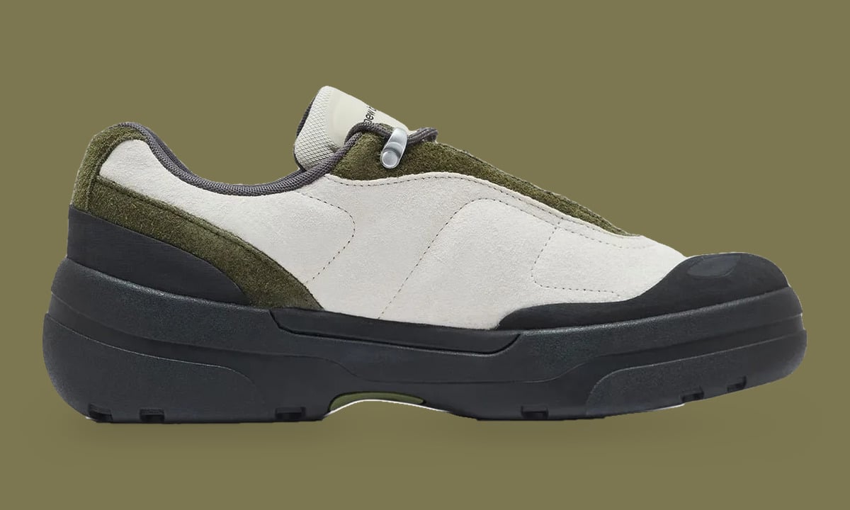 Medial view of a cream suede sneaker with olive trim, black toe cap and silver toggle lace, Army Green