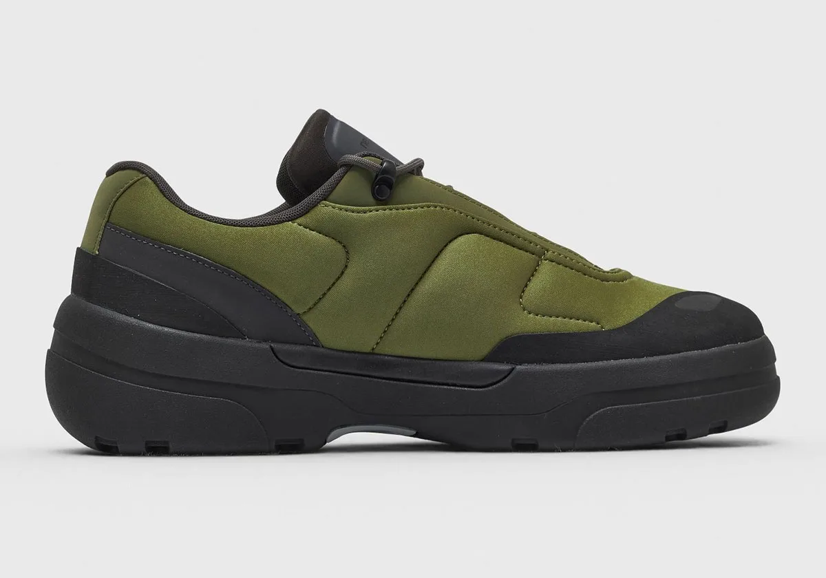 Lateral view on plain background: olive quilted upper, black rubber toe cap, thick black sole, Sport Green/Black