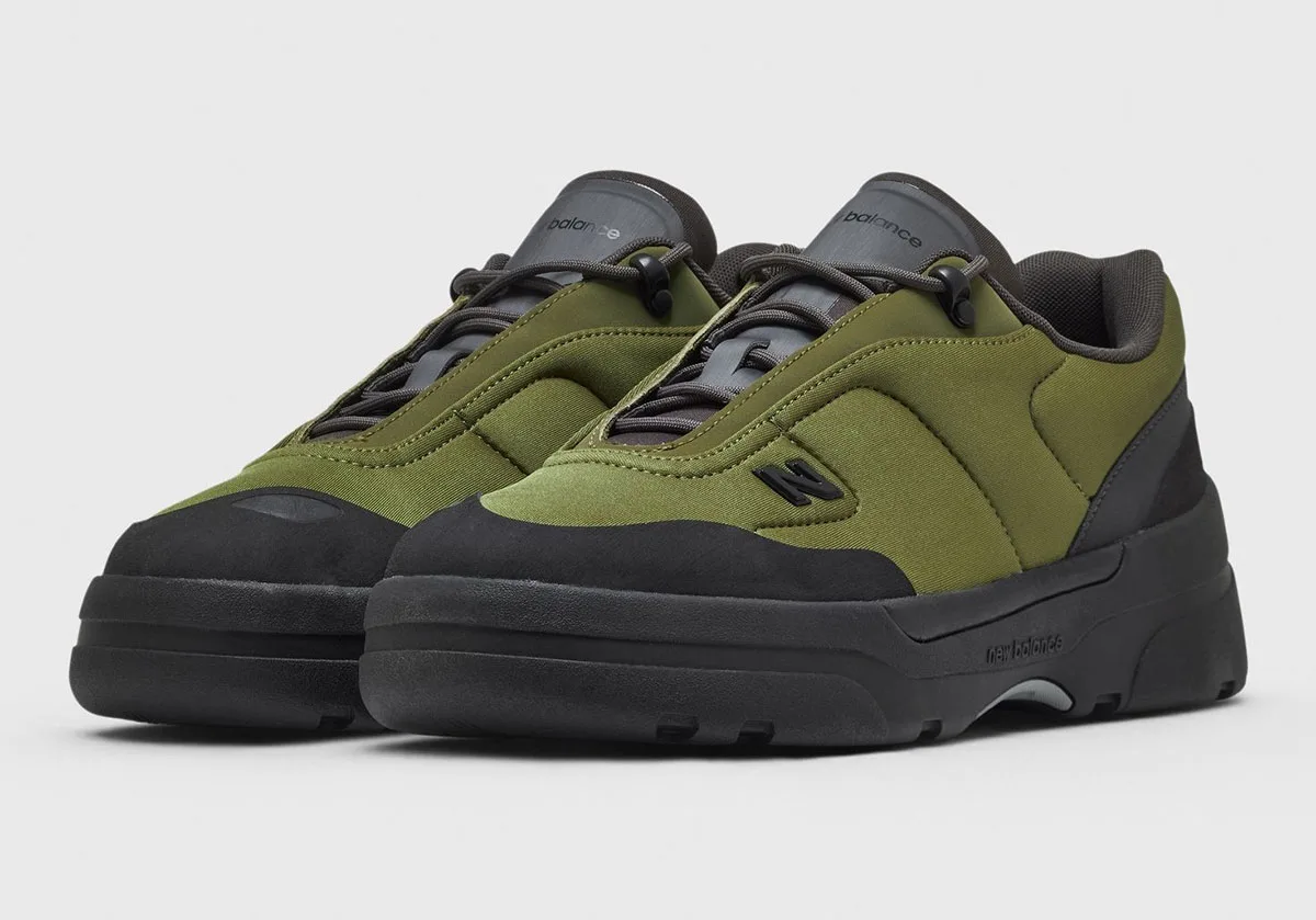 Pair, three-quarter front view: olive padded uppers, black toe caps, toggle laces, N logo, Sport Green/Black
