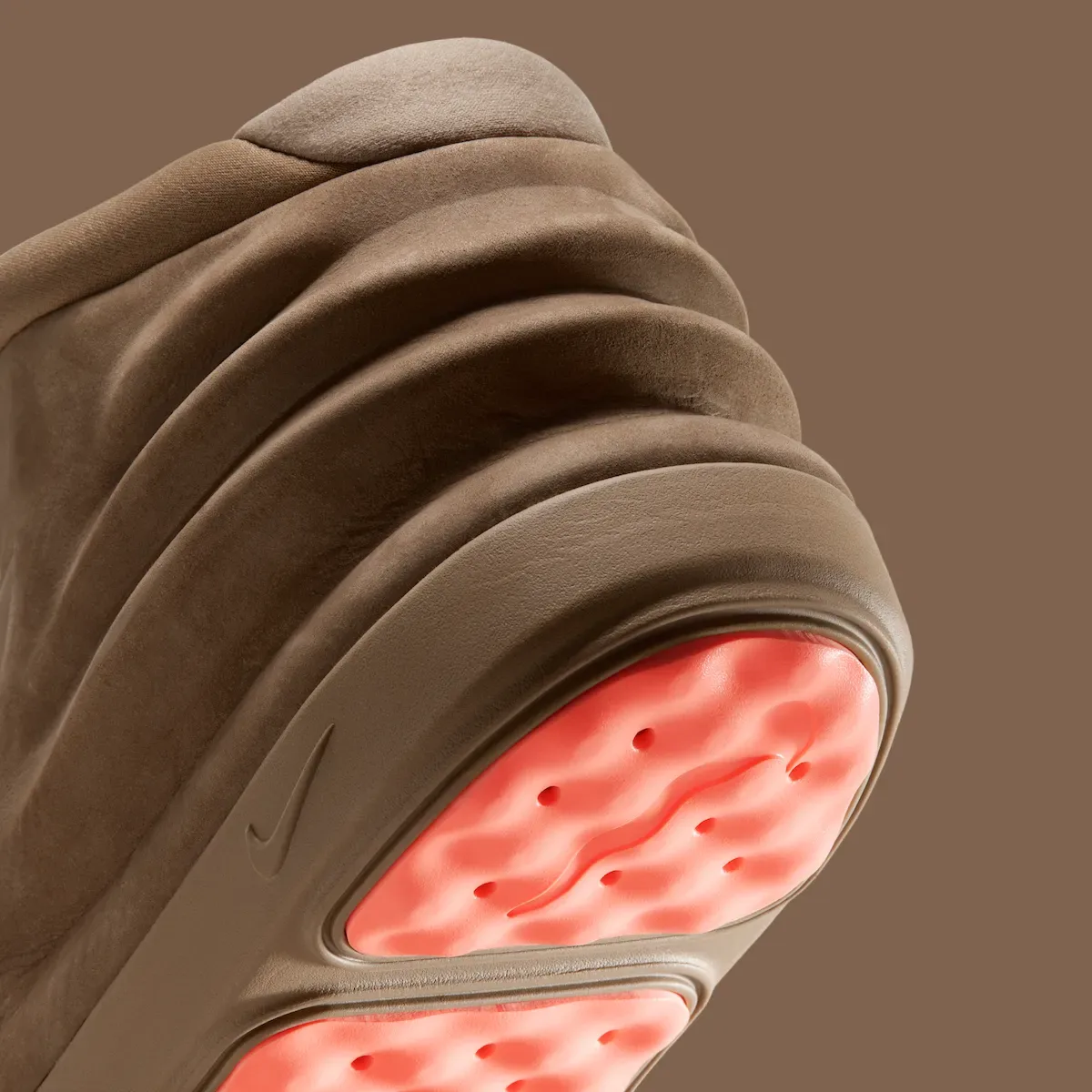 Angled detail of heel folds and pink dimpled outsole with swoosh on brown midsole, Dark Driftwood