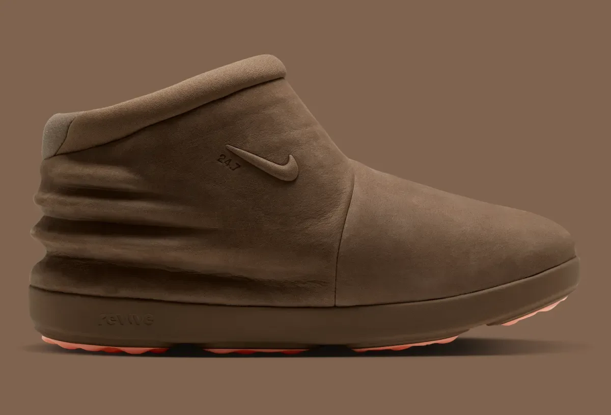 Lateral view of brown nubuck boot with 24.7 swoosh, creased heel and Revive text, Dark Driftwood