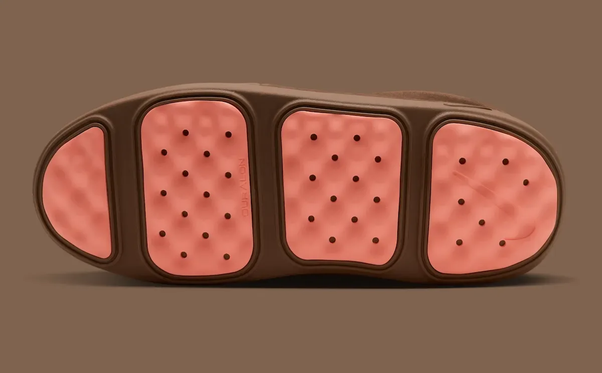 Outsole view with four pink dimpled pods separated by brown rubber, small holes, Dark Driftwood
