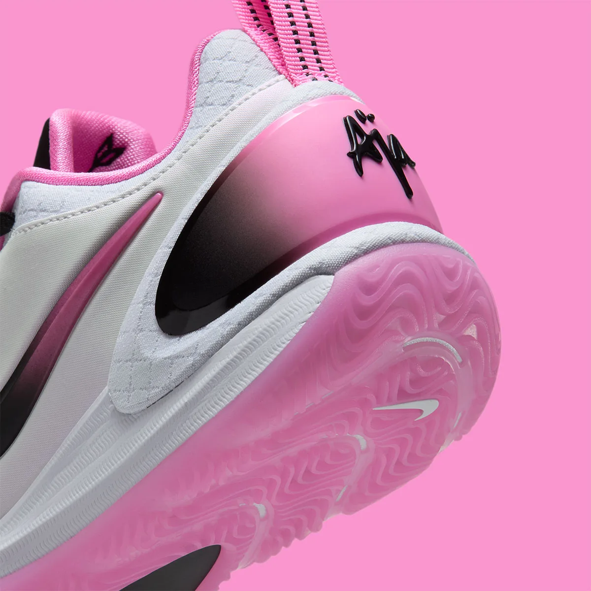 Detail of heel, black "Aja" script on pink-to-black gradient clip and translucent pink outsole, Cruise Control