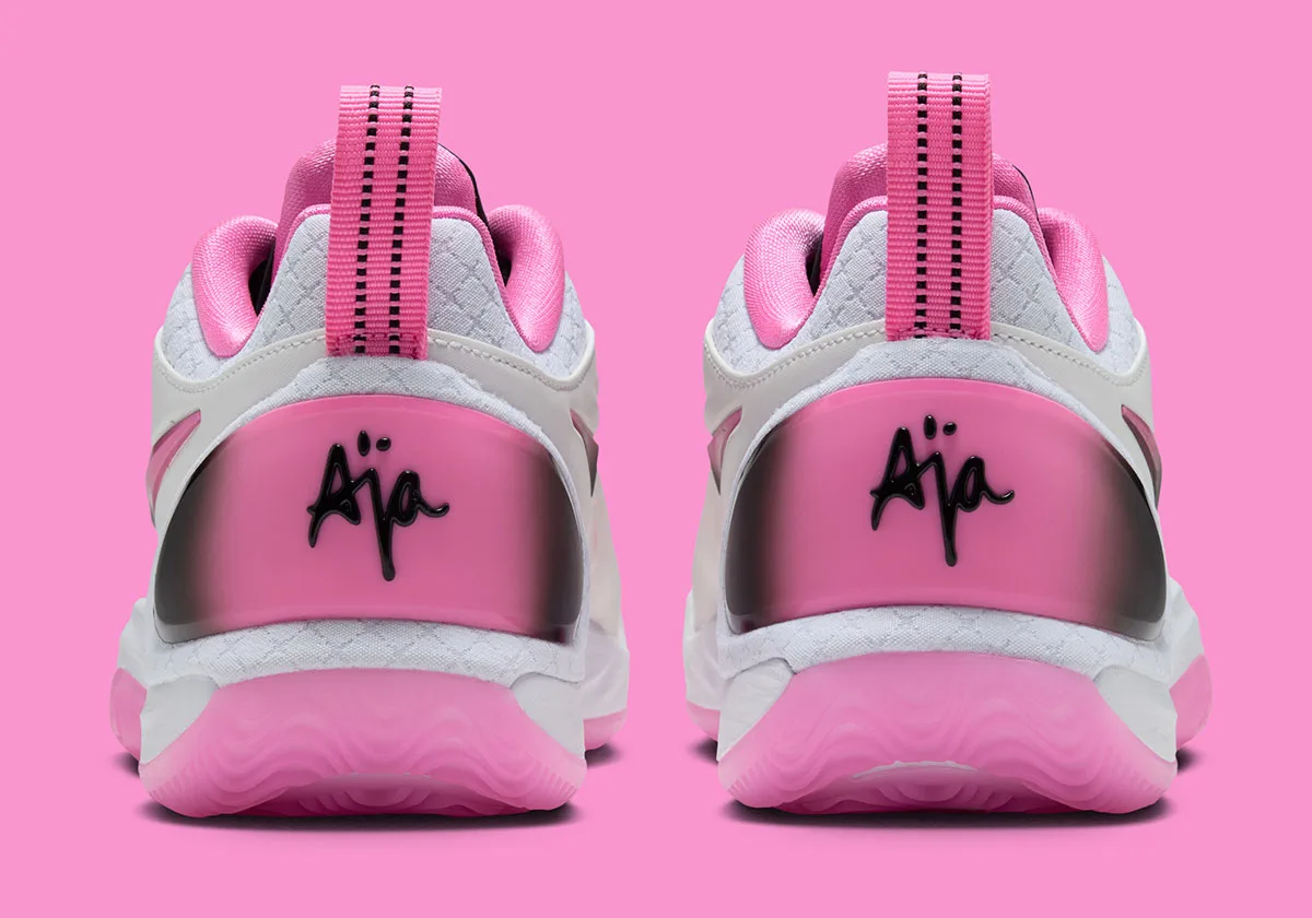 Pair from the heel, pink-to-black gradient clips with black "Aja" script and pink pull tabs, Cruise Control
