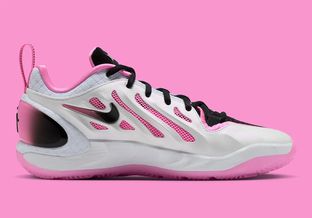 Medial view with pink mesh cutouts on white upper, black swoosh and pink-to-black heel clip, Cruise Control