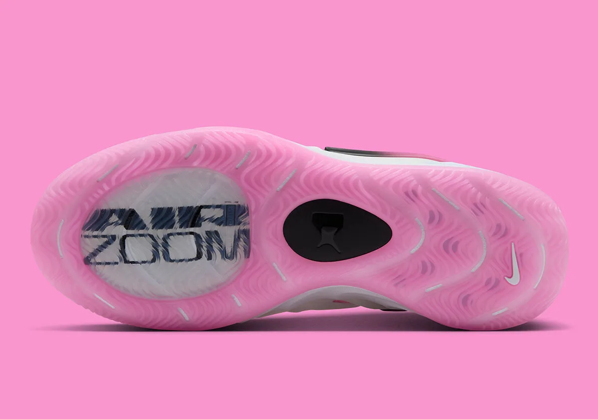Outsole view of translucent pink tread with visible "Air Zoom" unit and black circular plate, Cruise Control