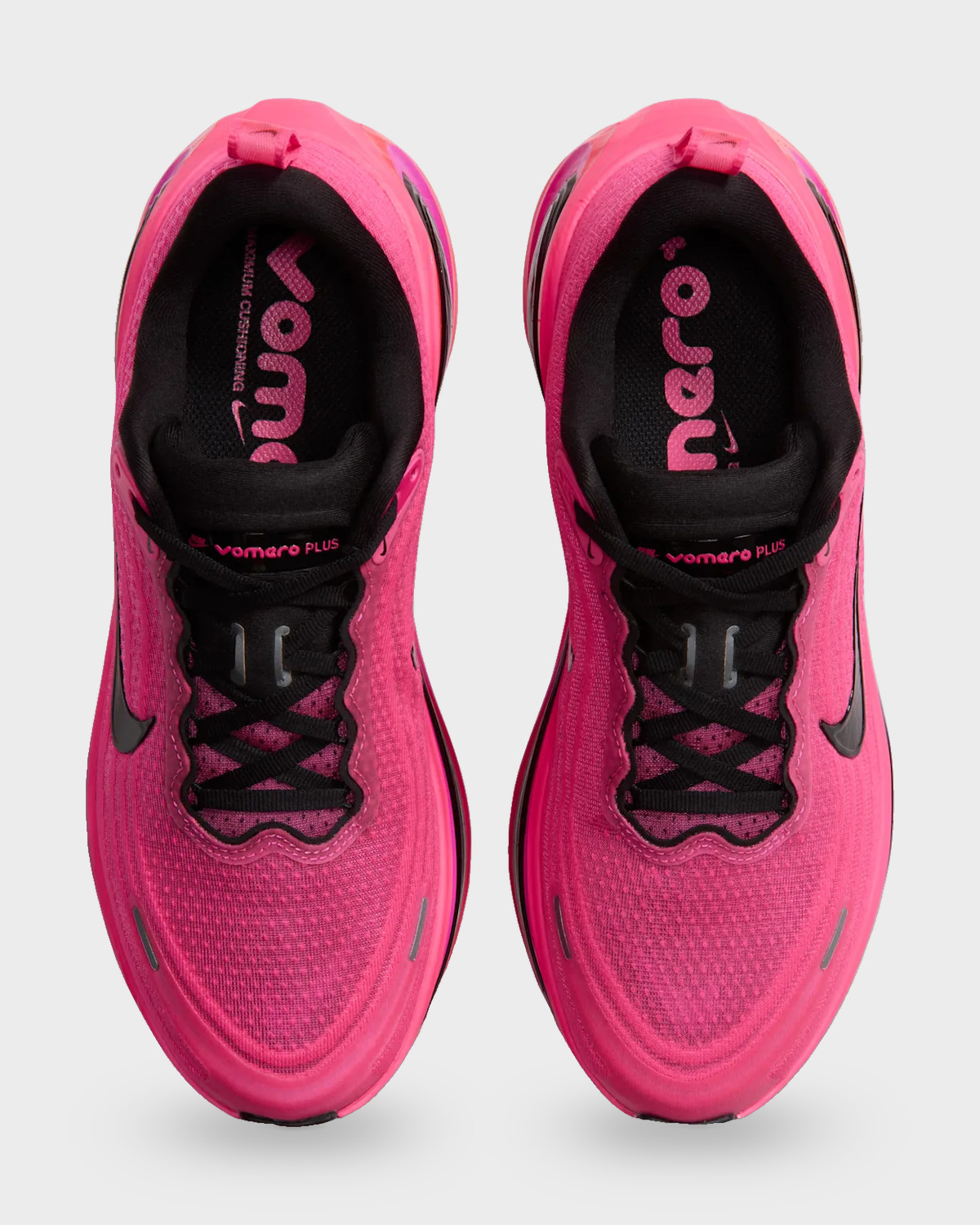 Top-down pair with pink mesh, black laces and Vomero Plus tongue labels, Dark Tour Collection