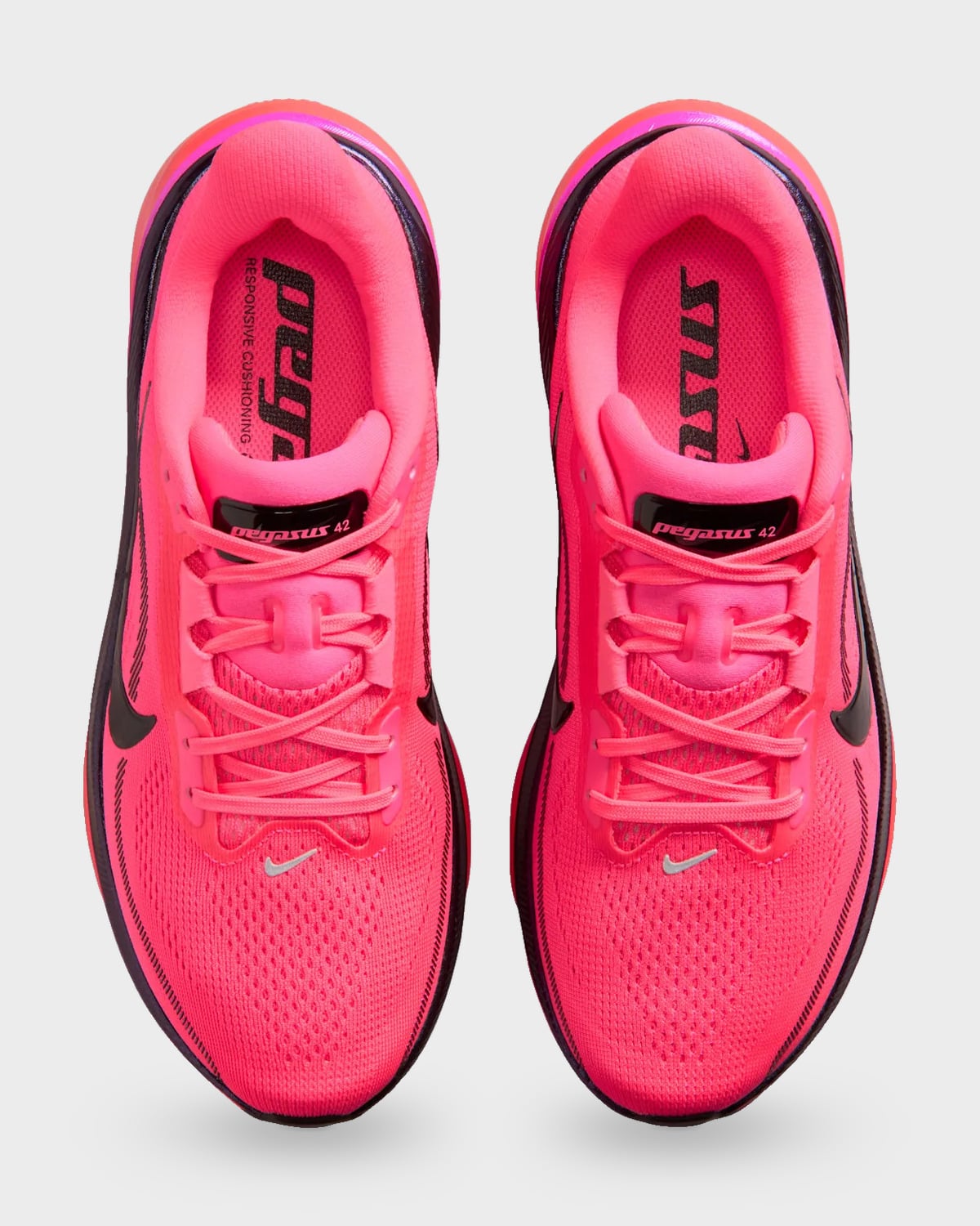 Top-down pair with bright pink mesh, pink laces and Pegasus 42 tongue labels, Dark Tour Collection