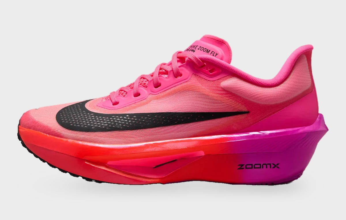 Lateral view with pale pink mesh, an elongated black Swoosh and orange midsole, Dark Tour Collection