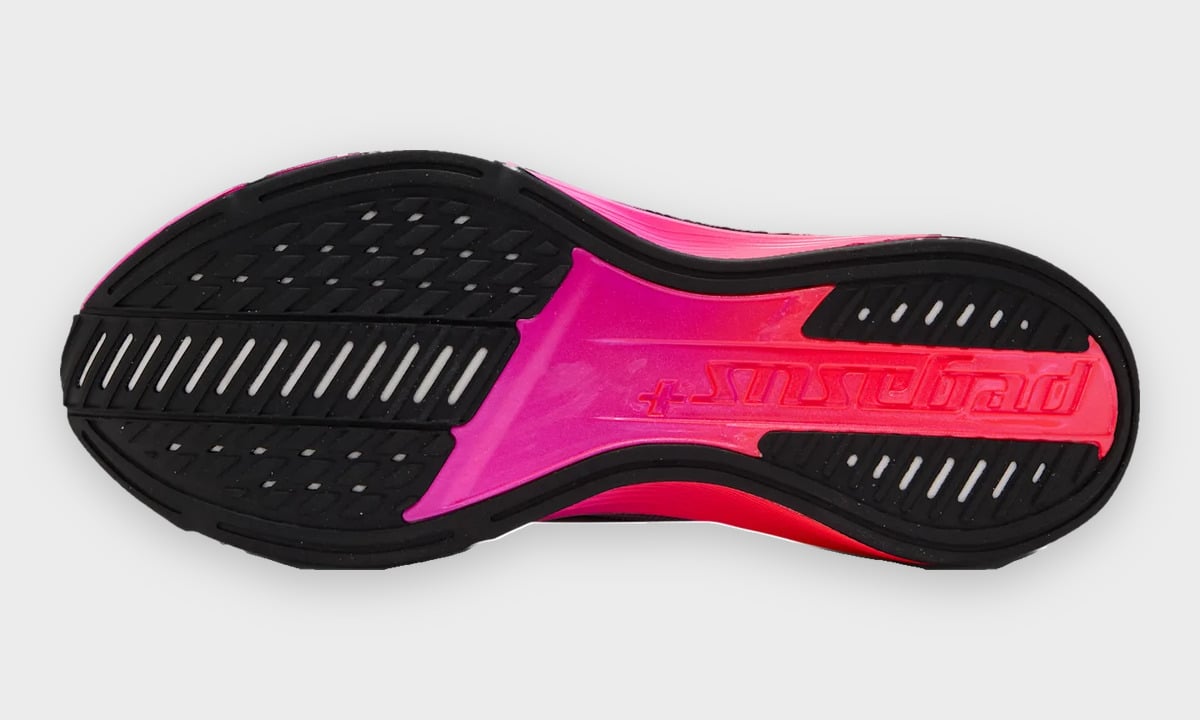 Outsole view with black grooved rubber and pink Pegasus+ lettering, Dark Tour Collection