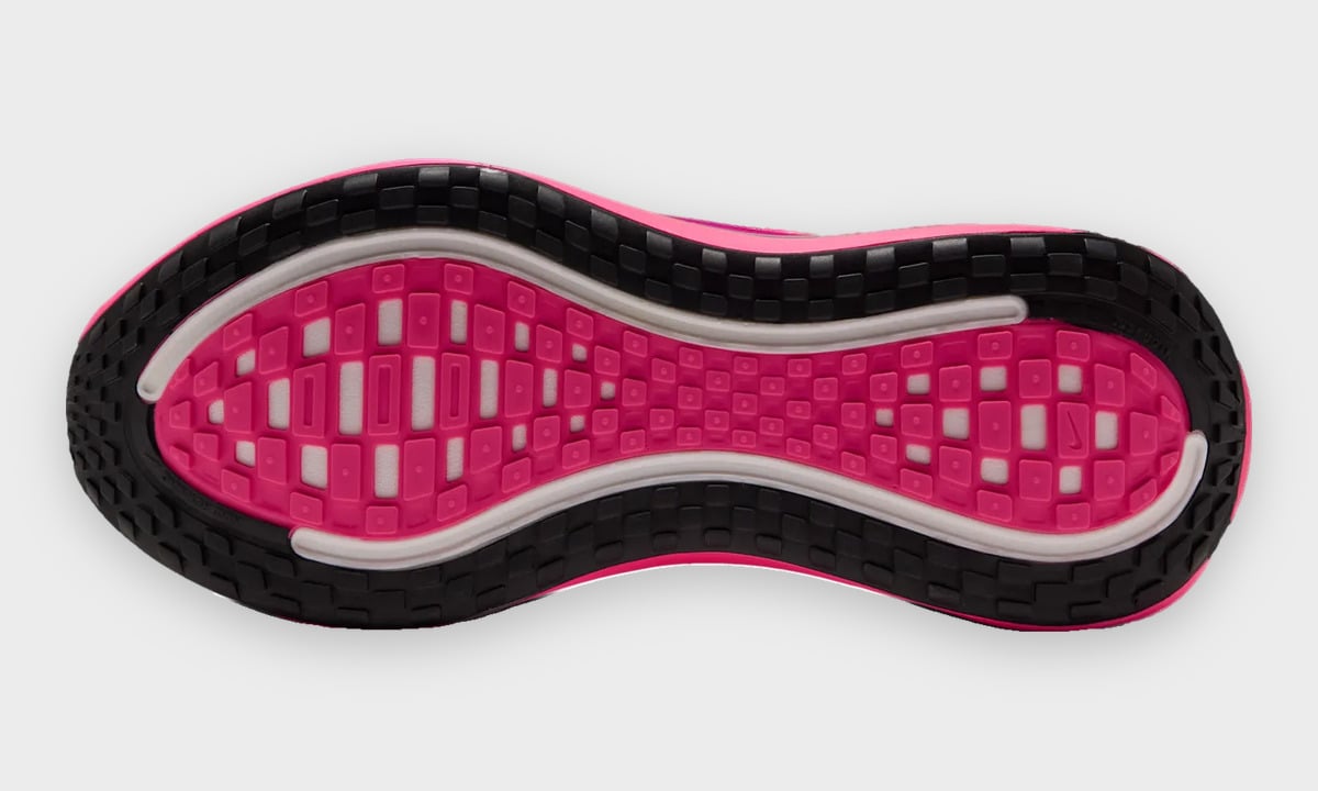 Outsole view with black perimeter tread, pink blocks and white channels, Dark Tour Collection