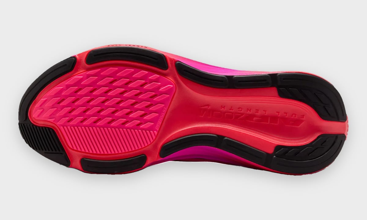 Outsole view with black rubber pods around a pink and red centre, Dark Tour Collection