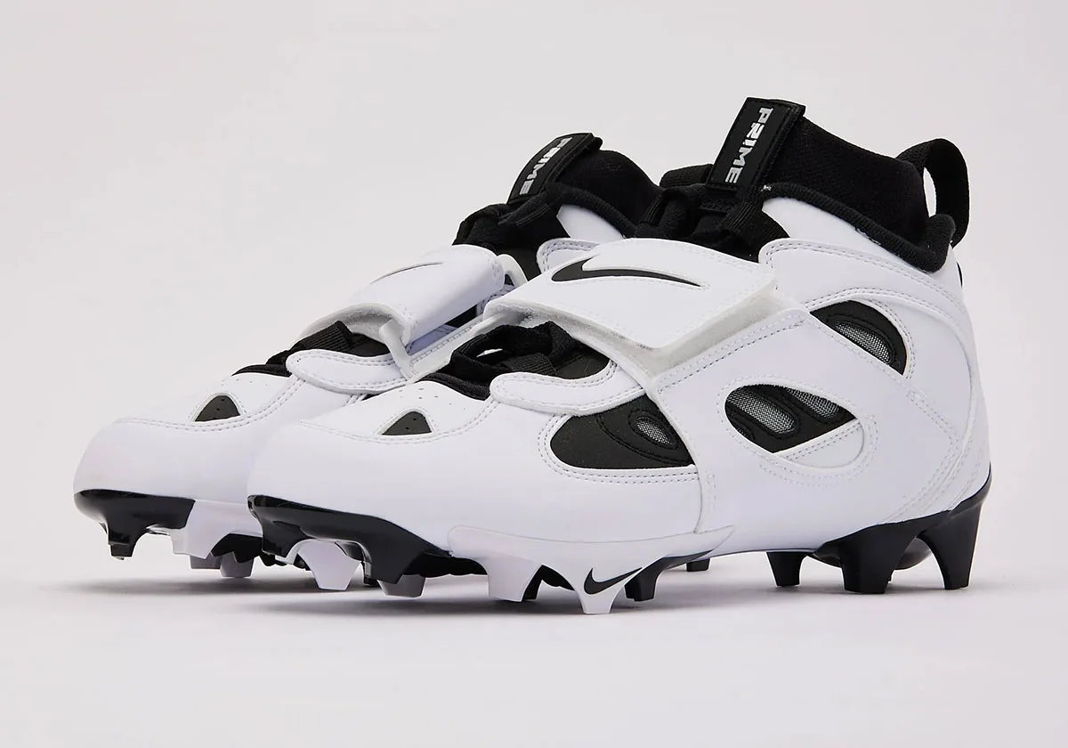 Pair at three-quarter angle, white leather with black Swoosh strap and PRIME tab on black collar, White/Black