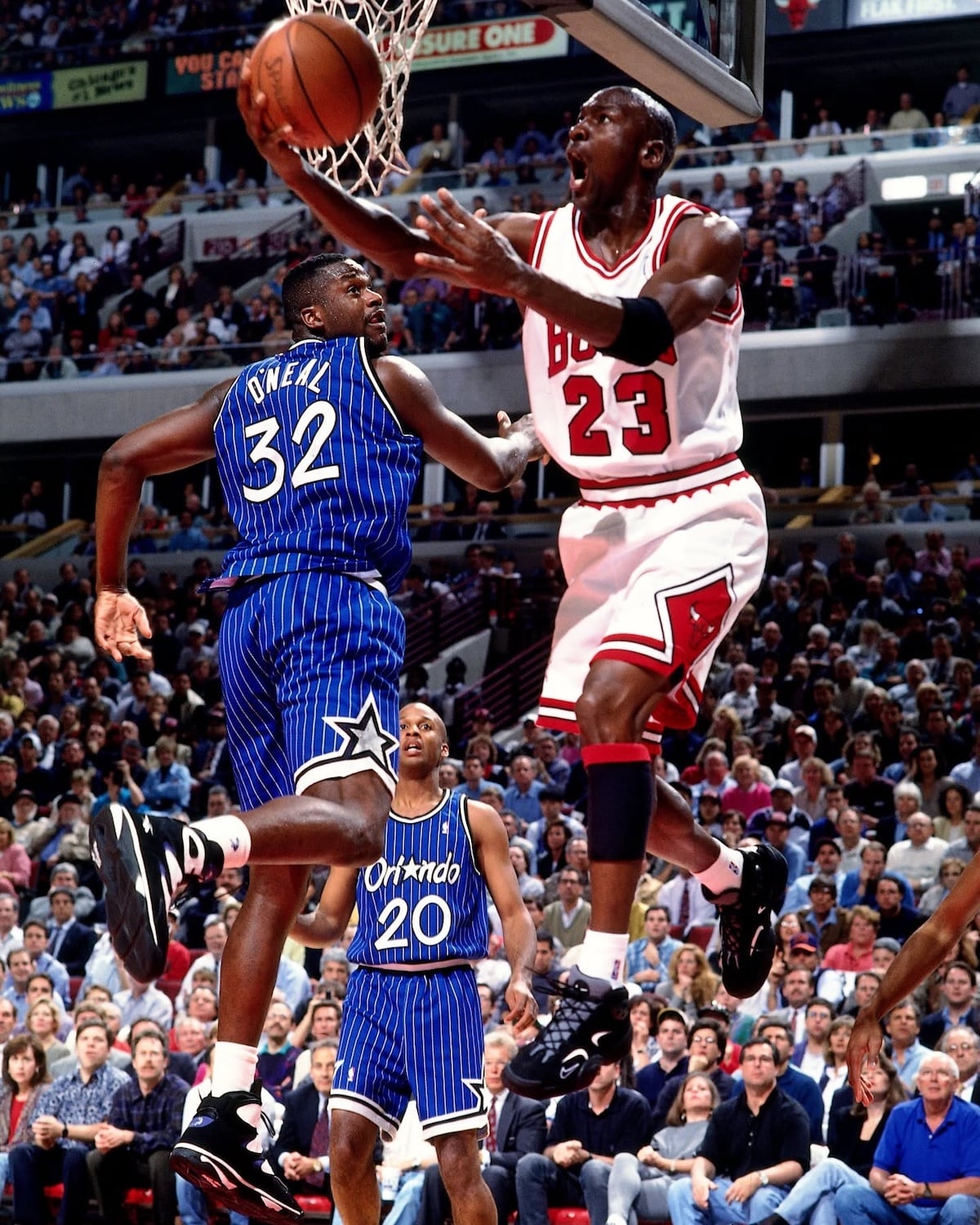 Michael Jordan goes up against Shaquille O’Neal in Game 3 of the 1995 Eastern Conference Semifinals, wearing the Nike Air Flight One