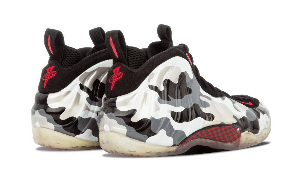 Heel view of a pair, red logo on black heel tabs, camo shell and translucent sole, Fighter Jet