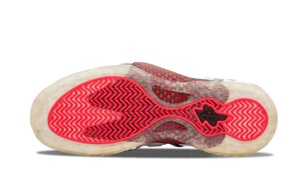 Outsole view with bright red zigzag tread, translucent edge and red mesh panel visible, Fighter Jet