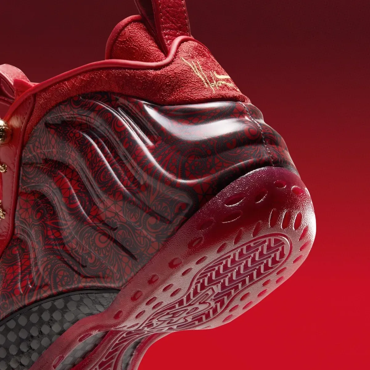 Detail of heel and outsole, lace-print shell, gold signature on red heel tab, red translucent sole, Gym Red