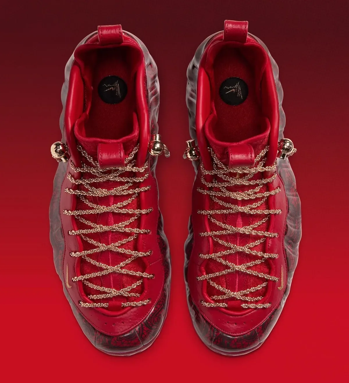 Top-down view of pair, gold chain laces crisscrossed, red interior with black circular insole logos, Gym Red