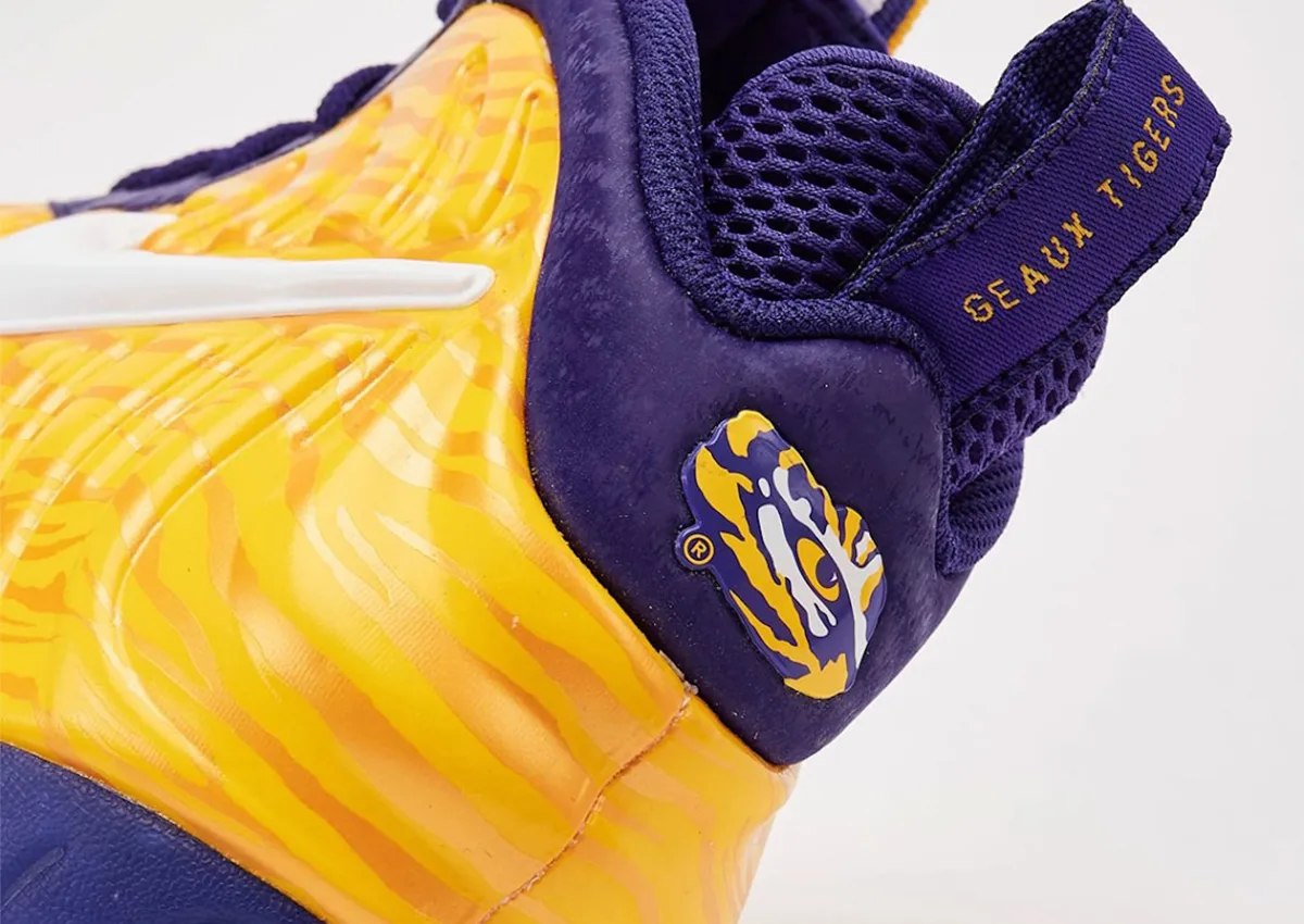 Heel detail, tiger-eye logo and gold “Geaux Tigers” text on purple pull tab, LSU Tigers