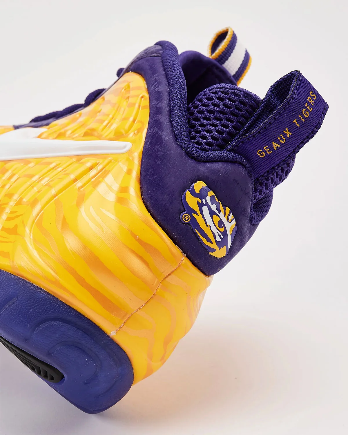Heel detail, tiger-eye logo on purple heel and “Geaux Tigers” text on pull tab, LSU Tigers