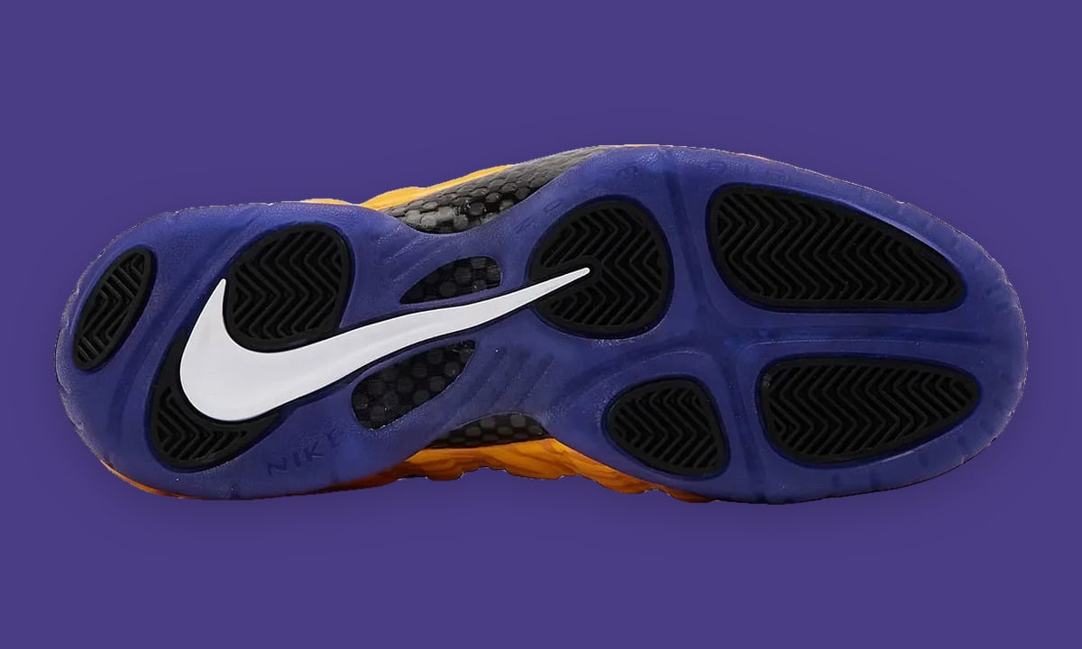 Outsole view, purple sole with white swoosh and black chevron-tread pods, LSU Tigers