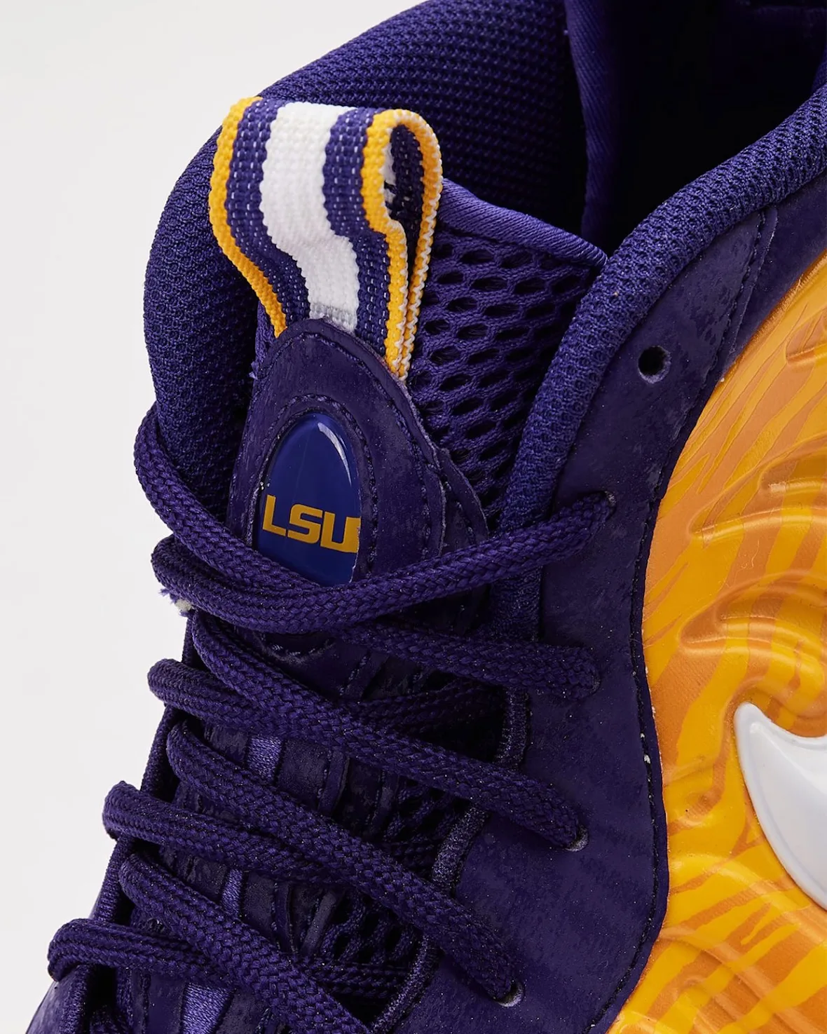 Tongue detail, blue “LSU” badge, striped white, gold and purple pull loop, purple laces, LSU Tigers