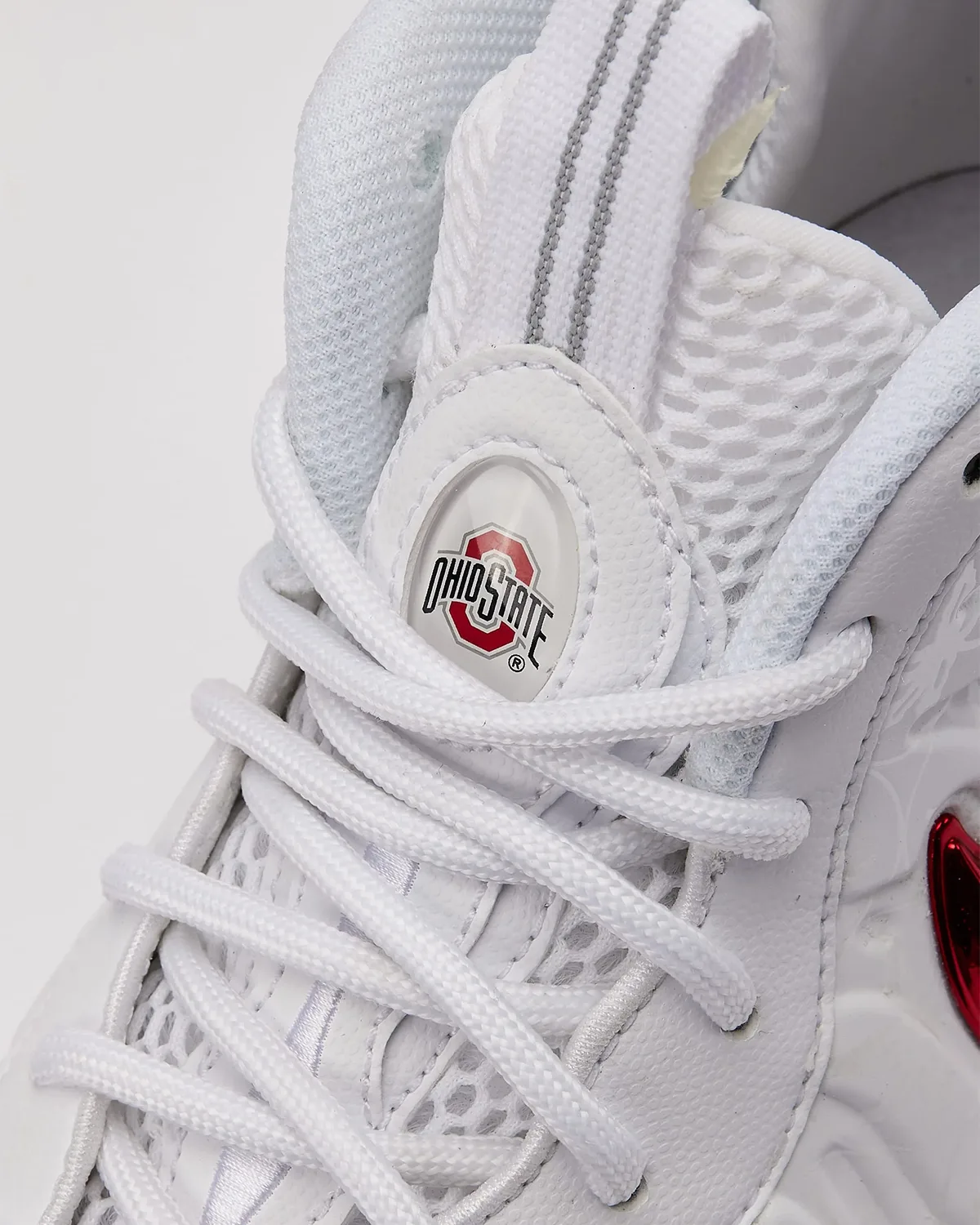 Detail, tongue top with Ohio State logo badge, white laces and mesh, reflective stripe, Ohio State