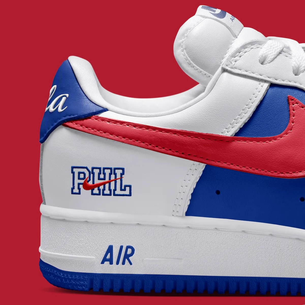 Detail of heel and midsole, blue Phila tab, PHL lettering with red swoosh, blue AIR, Philly