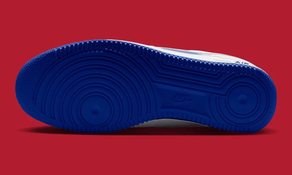 Outsole, royal blue tread with circular pivot patterns on red background, Philly