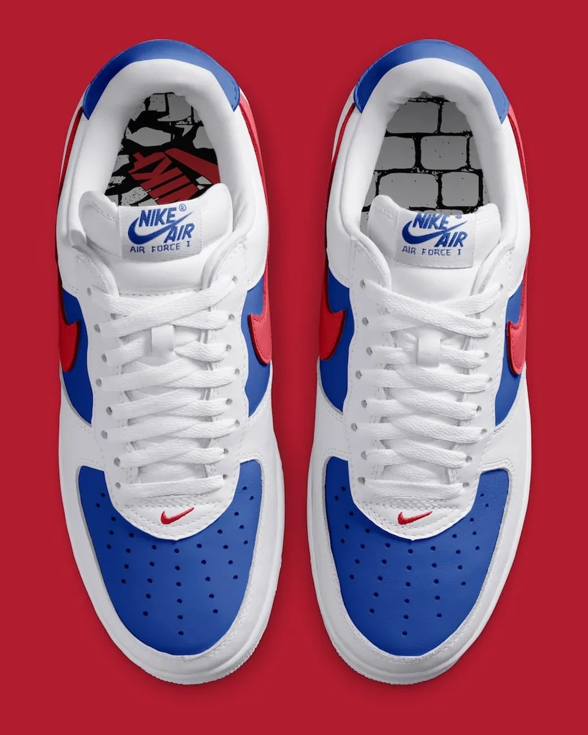 Top-down pair, white laces, blue toe boxes, red swooshes, Nike Air tongue labels, Philly