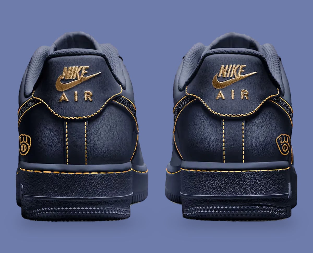 Heel view of pair, gold embroidered Nike Air logos and gold glove emblems on navy, Milwaukee Brewers