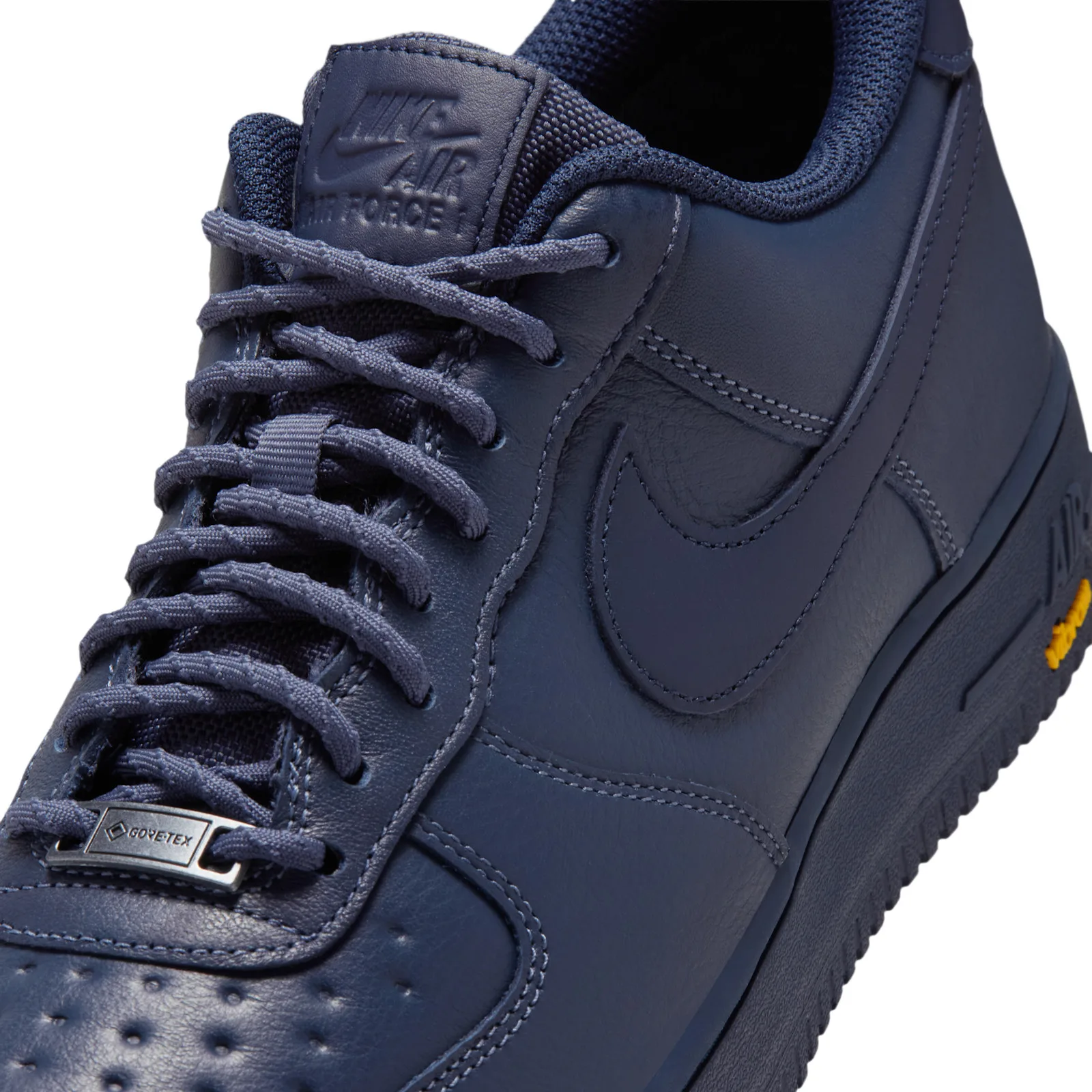 Detail of navy laces, Gore-Tex metal lace tag, tongue label and yellow Vibram logo, Thunder Blue