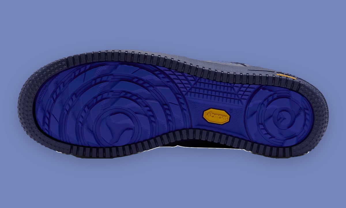 Outsole view with bright blue tread pattern, yellow Vibram logo and navy rim, Thunder Blue